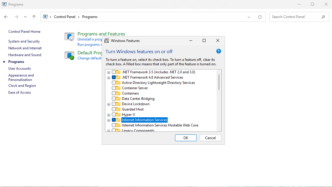 Windows Control Panel interface displaying “Windows Features” dialog, with options to enable components like .NET Framework versions, Active Directory Lightweight Directory Services, Hyper-V, and Internet Information Services.